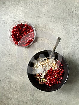 Barley porridge with coconut, pistachios, pomegranate seeds, pomegranate molasses