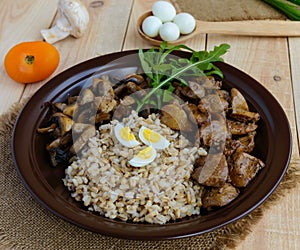 Barley porridge, fried mushrooms and duck liver, boiled quail eggs, tomatoes, arugula - healthy food