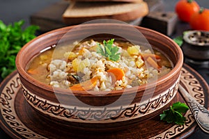 Barley soup with carrots, tomato, celery and meat