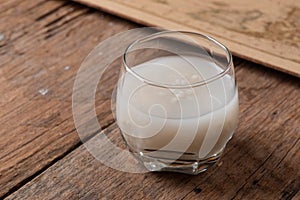 Barley water in glass with raw and cooked