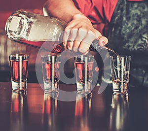 Barmaid making shots