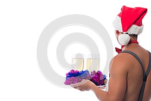 Barman with bare torso carrying champagne on a tray, isolated on white