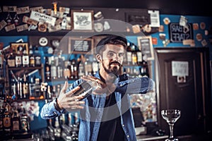 Barman concocts a cocktail in the pothouse