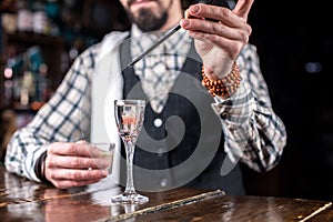 Barman makes a cocktail at the brasserie