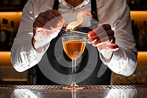 Barman making an alcoholic drink with a smoky note