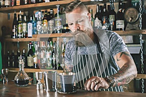 Barman is making cocktail