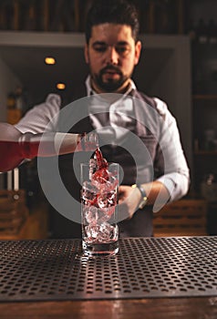 Barman making cocktail