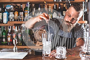 Barman is making cocktail