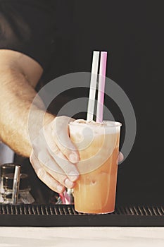 Barman is making cocktail