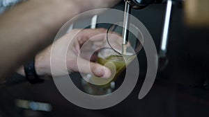 Barman pouring craft beer