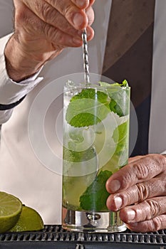 Barman preparing cocktail.