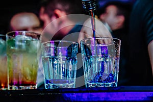 Barman preparing cocktails at the club