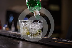 Barman preparing mojito cocktail