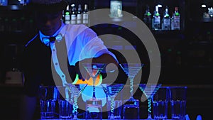 Barman show. barmen juggle two Beakers for mixing