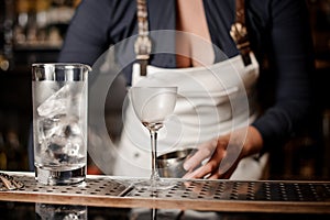 barman woman making a fresh summer cocktail