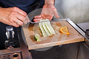 Barman at work, preparing cocktails. concept about service and beverages In the kitchen the restaurant