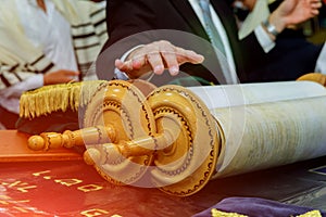 Barmitzvah reading Torah scrolls near Bar Mitzva in the Jewish Torah photo