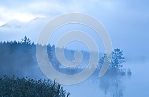 Barmsee and mounrains in morning fog