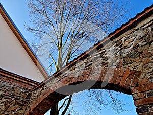 barn door ruins. repaired and retained parts of perimeter stone