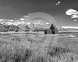 Barn in front of the Teton Range in black and white