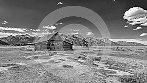 Barn in front of the Teton Range in black and white