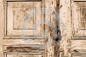 Barn lock rusty and old hanging on old wooden doors