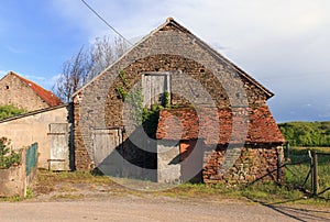 Barn and outbuilding with red tiled roof photo