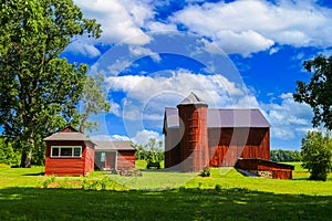barn red painted bards silo farm house building storage farming shelter backyard farmyard photo