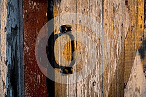 Barn side door handle during sunset