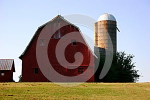 Barn and Silo against blue sky