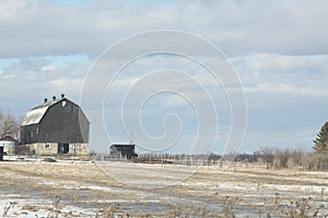 Barn in Snowy Field