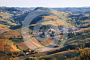 Barolo village view from the vineyard. Autumn landscape langhe nebbiolo vineyards hills. Viticulture Piedmont, Italy.
