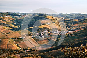 Barolo village view from the vineyard. Autumn landscape langhe nebbiolo vineyards hills. Viticulture Piedmont, Italy.