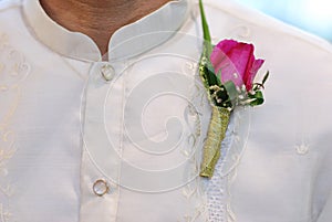 Barong Tagalog with pink corsage at wedding