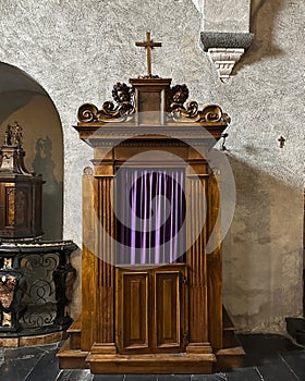 Baroque 17th century confessional by Giovanni Albiolo Church Saint George Varenna Lake Como