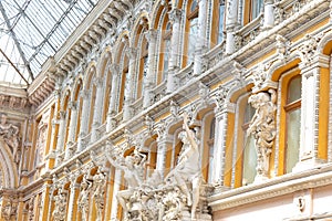 Baroque architectural building with columns and sculptures close up view, facade of old architecture