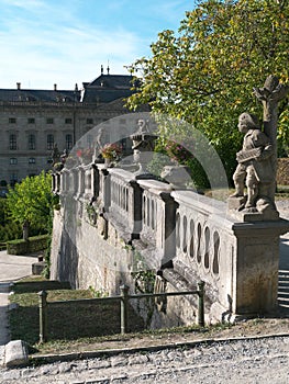 Baroque balustrade with sandstone statues in the courtyard garden