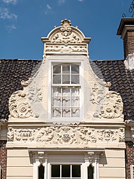 Baroque bell gable of former hay skippers house in center of Heeg, Friesland, Netherlands