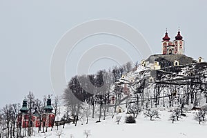 Baroque calvary of Banska Stiavnica, Slovakia, during winter season, clody skies. Lower, central and upper church