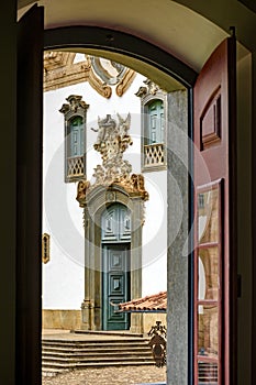 Baroque church front seen through the window