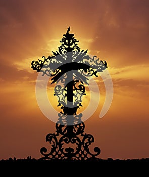 Baroque cross sunset