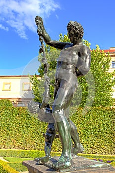 Baroque figures in the green Wallenstein Park in Prague