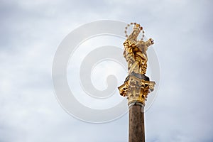 Baroque Marian plague column in main market square Republic square of Plzen, sunny day, statute of Virgin Mary, Medieval