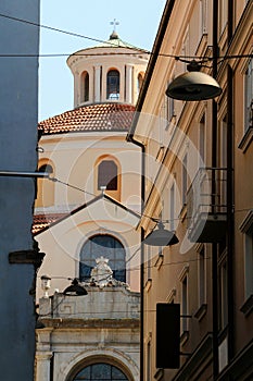 Baroque St. Vitus cathedral from narrow alley in Rijeka Croatia