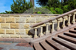 Baroque staircase with marble steps and stone balustrades.