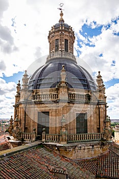 Baroque style bell tower and dome of La Clerecia building in Salamanca, Spain