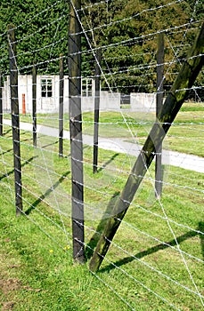 Barrack behind barbed wire in a concentration camp