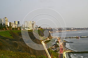 Barranco Peru coast with Pacific Ocean beach with the historic restaurant - Rosa Nautica - and a highway with traffic