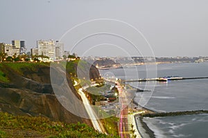 Barranco Peru coast with Pacific Ocean beach with the historic restaurant - Rosa Nautica - and a highway with traffic photo