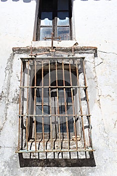 Barred window of an old house in Castano del Robledo, magical town of Andalusia. Huelva, Spain